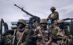 On guard: Kenyan and Congolese troops at Goma airport in eastern DR Congo in mid-November