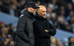 Rival bosses - Liverpool manager Jurgen Klopp (L) and Manchester City counterpart Pep Guardiola on the Etihad touchline