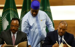 Peace deal: Ethiopian government representative Redwan Hussein, left, and Tigray's Getachew Reda at the November 2 signing ceremony in Pretoria