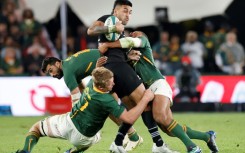 New Zealand centre Rieko Ioane (C) is surrounded by South Africans during an August 2022 Test in Johannesburg, which the tourists won.