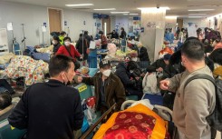 In Shanghai and Beijing, hospitals are suffering under a wave of cases