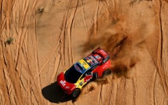 French rally great Sebastien Loeb lost further ground on overall leader and defending champion Nasser Al-Attiyah after rolling his car during the fifth stage