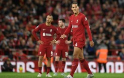 Injured - Liverpool defender Virgil van Dijk (R) 