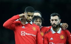 Marcus Rashford (left) celebrates with teammates after scoring Manchester United's third goal in their 3-1 win against Everton