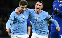 Manchester City's Julian Alvarez (L) celebrates with  Phil Foden