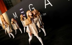 Models dressed as the scary android doll in Universal's horror film 'M3GAN' appeared on the red carpet at the premiere in Hollywood, California
