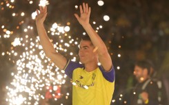 Al-Nassr's new forward Cristiano Ronaldo greets the fans during his unveiling at the Mrsool Park Stadium in the Saudi capital Riyadh on January 3, 2023