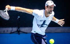 Novak Djokovic attends a practice match with Russia's Daniil Medvedev 
