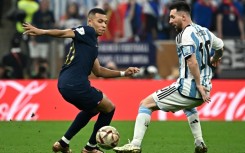 Kylian Mbappe and Lionel Messi come up against each other during last month's World Cup final