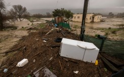 A refrigerator lay among debris deposited by flooding of the Salinas River in central California on January 14, 2023