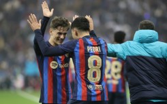 Barcelona midfielder Pedri celebrates with Gavi after scoring his team's third goal during the Spanish Super Cup final