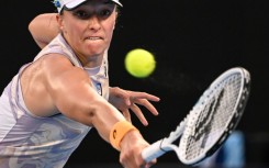 Top seed Iga Swiatek hits a return against Germany's Jule Niemeier