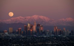 The San Gabriel Mountains loom over the Los Angeles skyline 