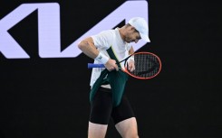 Britain's Andy Murray adjusts his shorts  against Australia's Thanasi Kokkinakis