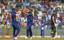 Mohammed Shami (centre) returned impressive figures of 3-18 from six overs