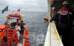 South Korean coast guards are searching for crew from a cargo ship that sank off the southern island of Jeju
