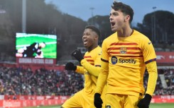 Barcelona's Spanish midfielder Pedri celebrates scoring the opening goal at Girona on Saturday