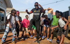 Eddy Kenzo rehearses a routine with Ghetto Kids, a prominent dance group in Uganda