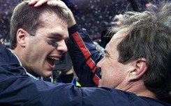 Tom Brady and New England Patriots head coach Bill Belichick embrace after the Super Bowl win against St. Louis Rams in 2002