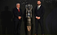 Wales coach Warren Gatland (L) and Ireland counterpart Andy Farrell pose with the Six Nations trophy, ahead of their tournament opener in Cardiff