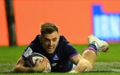 Scotland's Ben White scores a try against England at Murrayfield in 2022