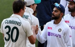 India's Virat Kohli congratulates Australia's Pat Cummins after the two sides met in a Test in December 2020 in Adelaide