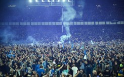 Everton fans invaded the pitch after securing Premier League survival last season