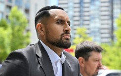 Nick Kyrgios arrives on crutches to the magistrate's court in Canberra