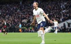 Tottenham striker Harry Kane celebrates after becoming his club's record goalscorer