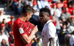 Mallorca defender Antonio Raillo (L) argues with Real Madrid's Brazilian forward Vinicius Junior