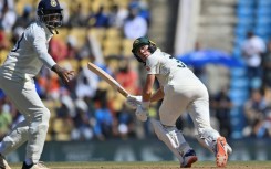 Australia's Marnus Labuschagne (R) looks back after playing a shot in Nagpur