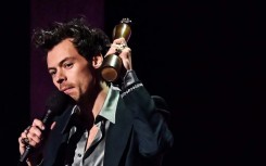 British singer Harry Styles celebrates after receiving the artist of the year award during BRIT Awards 2023  ceremony 