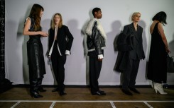 Models wearing clothing by Proenza Schouler gather backstage prior to their runway show during New York Fashion Week