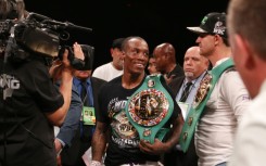 O'Shaquie Foster celebrates his unanimous decision victory over Rey Vargas for the vacant WBC super-featherweight title in San Antonio