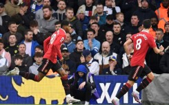 Manchester United's Marcus Rashford (L) celebrates scoring against Leeds