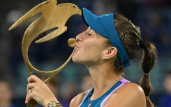Epic victory: Belinda Bencic kisses the trophy