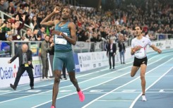 Ethiopia's Lamecha Girma broke the 3,000m world indoor record that had stood since 1998