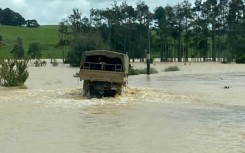 A New Zealand Defence Force truck driving through floodwaters near Dargaville on the North Island