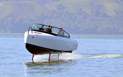 French sailor Tanguy de Lamotte, CEO of Candela US, drives the company's "flying" electric C-8 boat in Sausalito, California on February 8, 2023