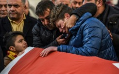 Mourners weep over the casket of one of the victims of a terrorist attack on a nightclub in Istanbul, Turkey, on January 1, 2017 
