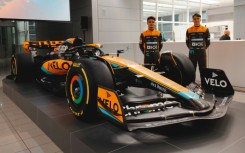 Lando Norris (left) and Oscar Piastri with the new McLaren MCL60 car they will drive for the 2023 season