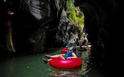 A tourist floats down the Colombia's Guape Canyon, formerly a route for armed rebels, on February 19, 2022