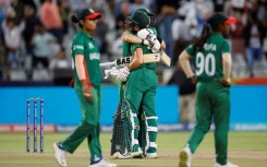 Laura Wolvaardt and Tazmin Brits celebrate after beating Bangladesh