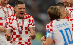 Dejan Lovren celebrates after Croatia beat Morocco to take third place at the World Cup in what was to be his final international
