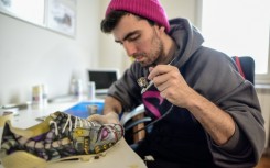 Using an array of paints, Satja Grabuloski and his team of seven artists turn ordinary shoes into works of art  