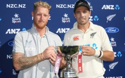 England captain Ben Stokes (L) and New Zealand's Tim Southee share the trophy after drawing the series 1-1
