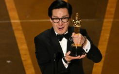 Ke Huy Quan accepts the Oscar for best supporting actor for "Everything Everywhere All at Once" 
