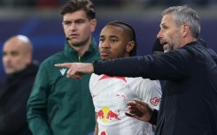 Leipzig head coach Marco Rose talks to French forward Christopher Nkunku. The forward has 12 goals in the league for Leipzig this season, the second-highest in the Bundesliga 