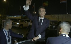 Macron arrives in Gabon, welcomed by cheers at the airport