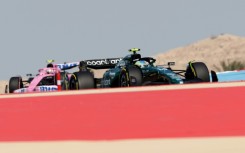 Two-time Formula One champion Fernando Alonso (R) confirmed in the first practice session for the Bahrain Grand Prix the good impression he and his Aston Martin car had given in testing last week